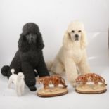 Two large resin poodles, other poodle models and ornaments,