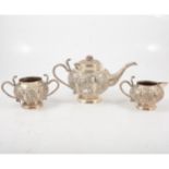 An Indian silver-plated three piece teaset.