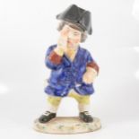 A 19th century snuff taking standing man toby jug with hat.