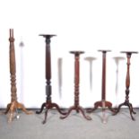 Four mahogany jardiniere stands and a standard lamp