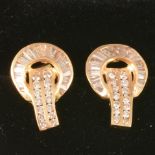 A pair of diamond earstuds with brilliant and baguette cut stones.