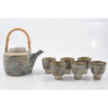 David Leach, a stoneware teapot and six tea bowls