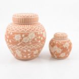 Two terracotta and sgraffito ginger jar and covers by Peter and Gaye Fishley Holland