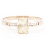 Natural yellow sapphire and diamond ring.