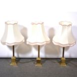 Set of three brass table lamps,