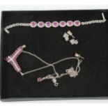 A collection of ruby jewellery set into silver.
