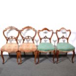 Two pairs of Victorian walnut dining chairs,