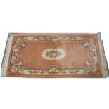 Three Chinese wool rugs,