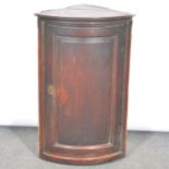 George III oak cylinder front hanging corner cupboard,