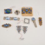 Brooches, dress clips and a buckle set with blue paste.