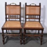Pair of French oak hall chairs,