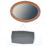 Oak framed wall mirror and a bevelled edge wall mirror,