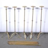 Set of five tall pricket candlesticks, fender and brass stair rods,