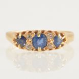 A Victorian sapphire and diamond half hoop ring.