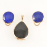 A pair of lapis lazuli earrings and black onyx pendant.