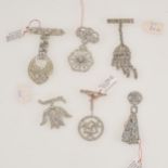 Six paste set fob brooches/clips.