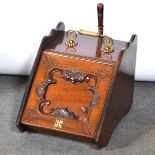 A mahogany slope front coal scuttle with liner and brass shovel.