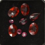 Gem Collector - Nine loose, faceted garnets.