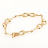 An 18 carat yellow gold bridle bit bracelet.