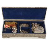 A jewel box with silver and costume jewellery.
