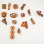 Sixteen vintage wooden and composite dress clips, brooches and bracelet.