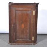 Georgian oak hanging corner cupboard.