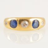 A sapphire and diamond roman set ring.