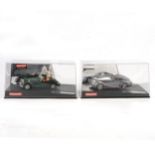 Two Carrera Evolution slot-car racing models.