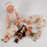 Seven miniature and baby dolls; including Armand Marseille