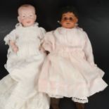 Two bisque head dolls. Ernst Heubach and Kammer and Rheinhardt.