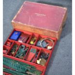 Meccano, a c1930s collection of parts in a wooden case.