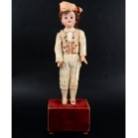 Bisque head doll, mounted on musical box base, head stamp 44-205