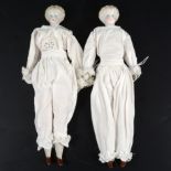 Pair of German glazed porcelain head dolls, painted features and shoes