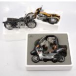 Three 1:18 scale model motor-cycles.