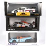 Three 1:18 scale models racing cars; including Norev Porsche 917K
