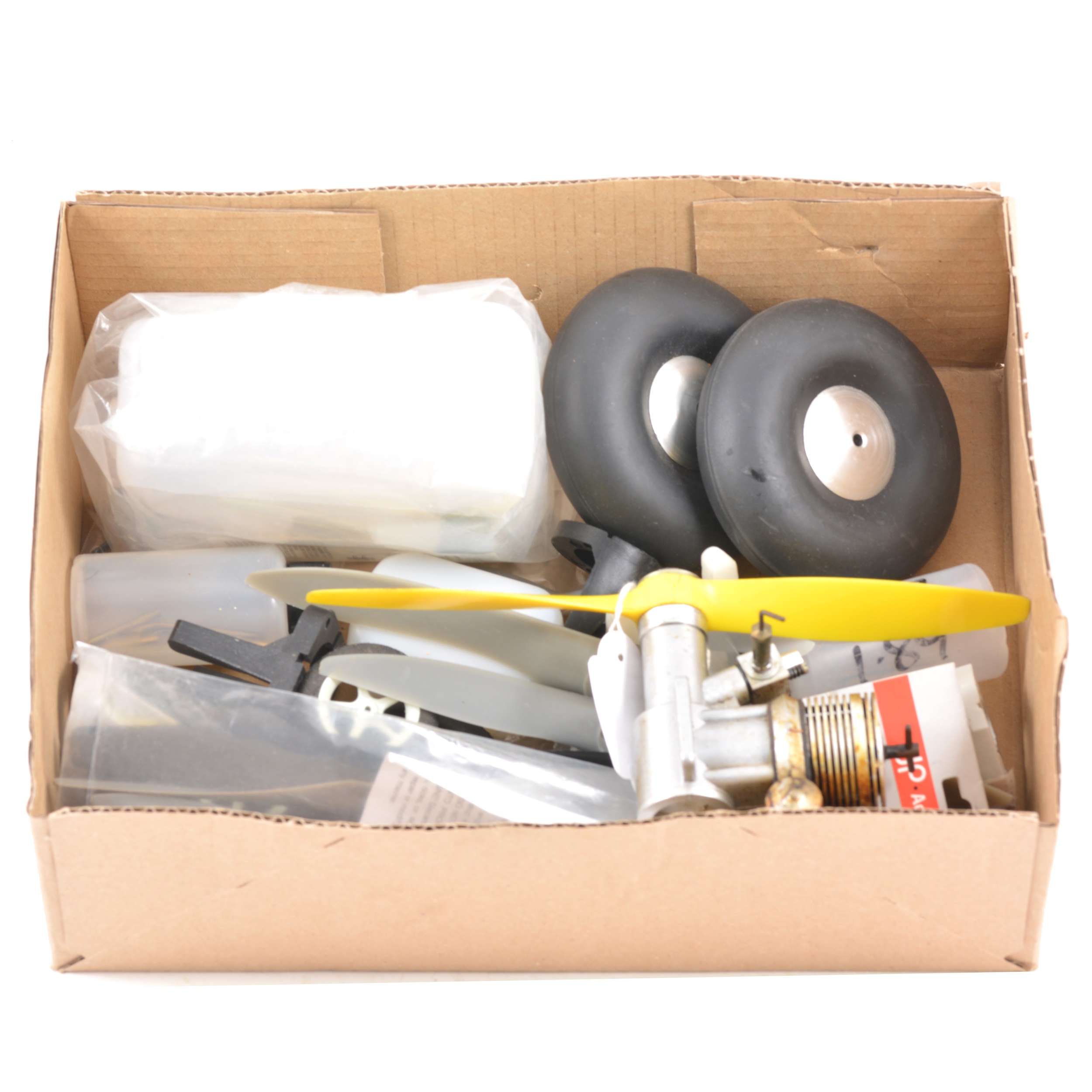 Box containing 11 assorted props, Wheels, Fuel tanks and engine mounts, and