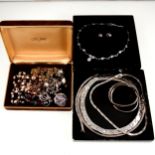 A collection of silver and costume jewellery, pearl necklaces.