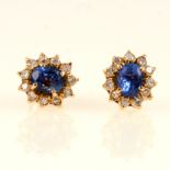 A pair of sapphire and diamond oval cluster earstuds.