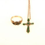 An emerald and diamond cross and chain and ring.