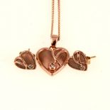 Clogau Welsh gold diamond set heart shaped pendant and earstuds.