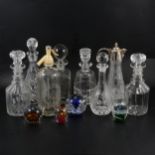 A collection of glassware, including paperweights.