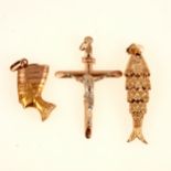 Three gold pendants, fish, crucifix and Nefertiti.