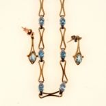Necklace and earring set with aqua coloured stones.