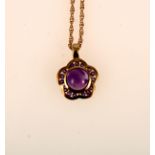 An amethyst pendant and chain.