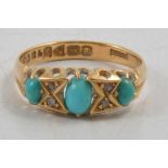 A turquoise and diamond half hoop ring.