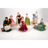 Seven Royal Doulton and Royal Worcester figurines.