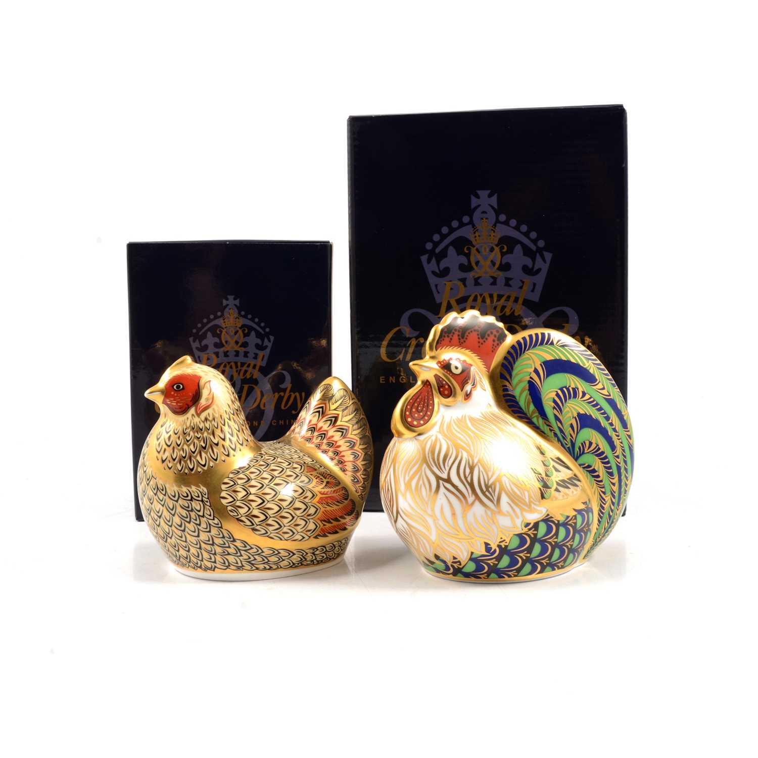 Two Royal Crown Derby Limited Edition paperweights, cockerel and hen, gold stoppers.