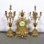 Three-piece mantel garniture and a pair of candelabra.