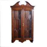 A mahogany wall mounted display cabinet.