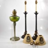 Art Nouveau style oil lamp; and pair of wooden table lamps.